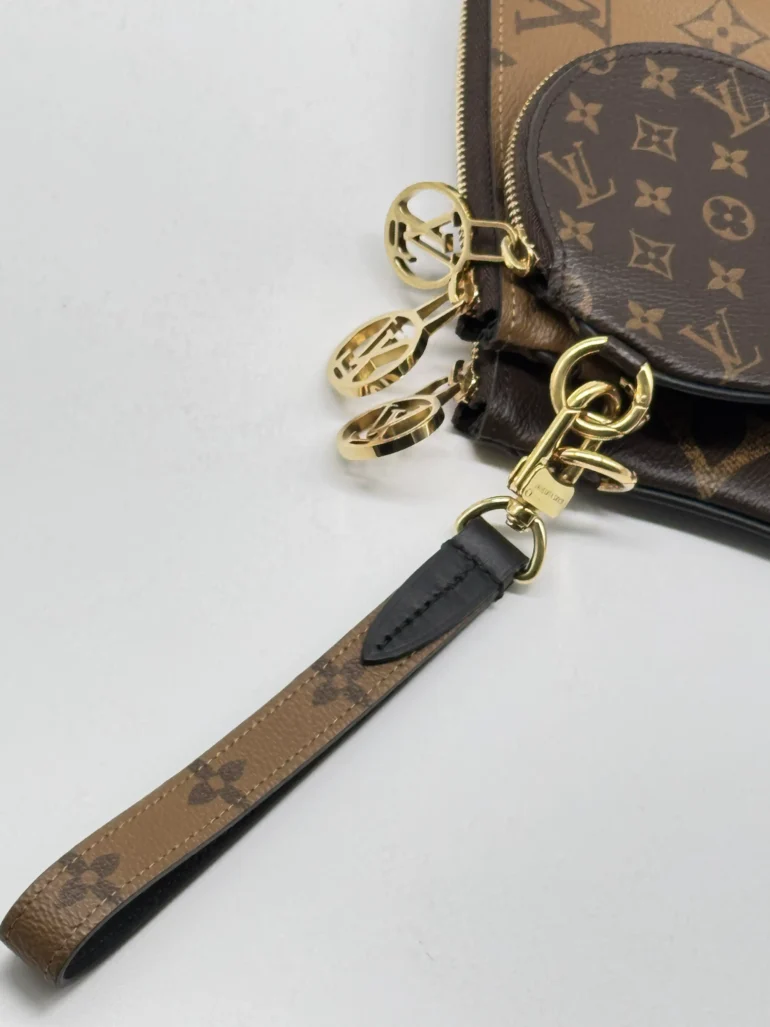 Pre Owned Louis Vuitton Reverse Monogram Giant Trio Pouch